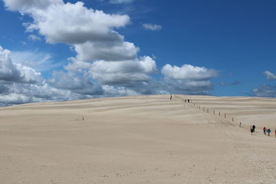 Scenic view of sand against sky