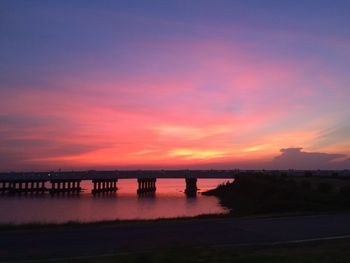 Scenic view of dramatic sky over sea during sunset