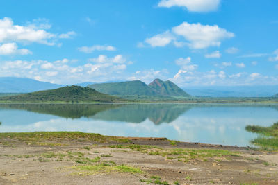 Scenic view of lake elementaita and sleeping warrior hill against sky in naivasha, kenya 