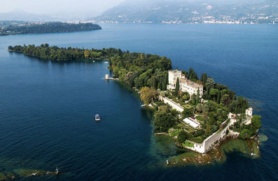 High angle view of sea and buildings in city