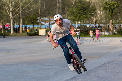 Man riding bicycle on road