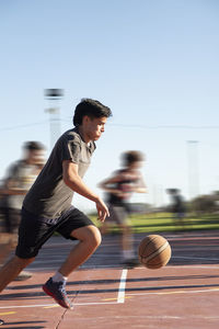 Young basketball player running