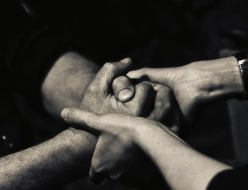 Close-up of couple holding hands