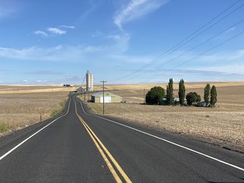 Empty road against sky