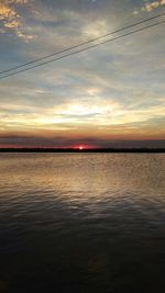 Scenic view of sea against sky at sunset