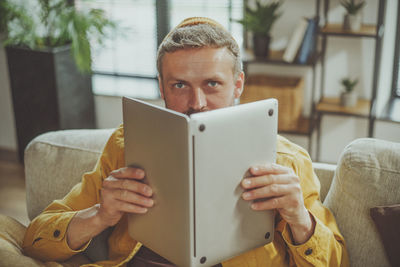 Midsection of woman using laptop