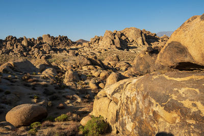 Scenic view of rock formations in desert against clear sky