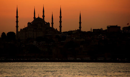 Silhouette of buildings at waterfront