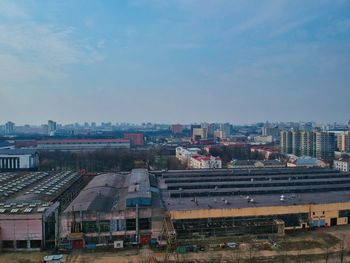 High angle view of buildings in city against sky