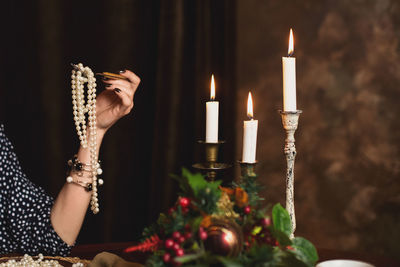 Midsection of woman holding christmas tree