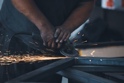 Low section of man working in workshop