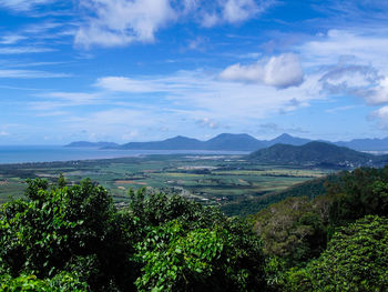 Scenic view of mountains against cloudy sky