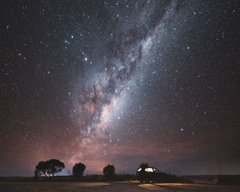 Scenic view of star field against sky at night