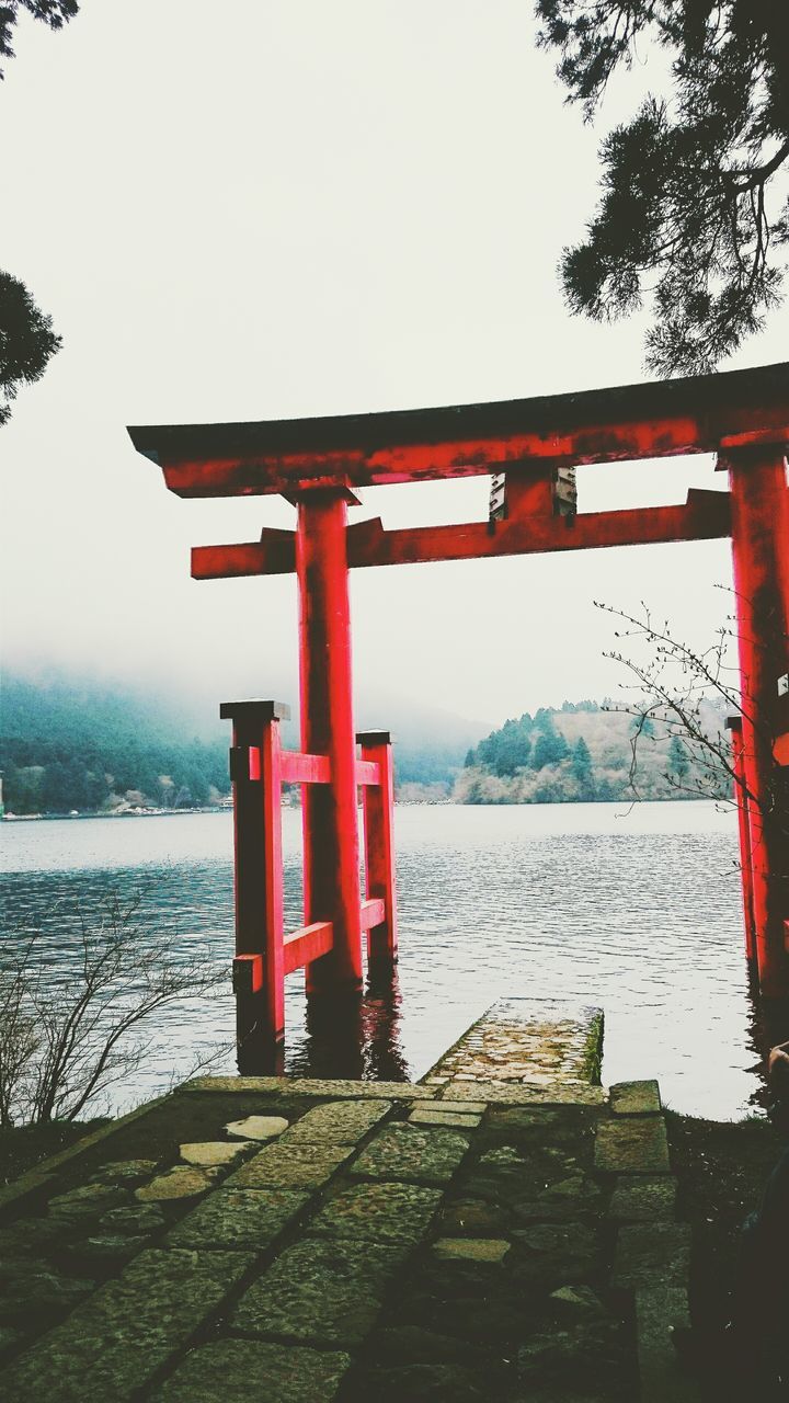 RED PIER OVER CALM SEA