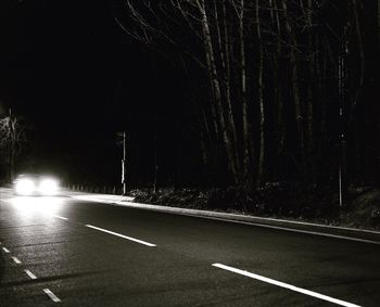 Road against sky at night