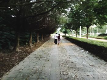 Full length of woman walking on road