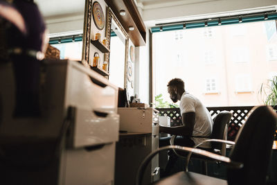 Male barber working in hair salon