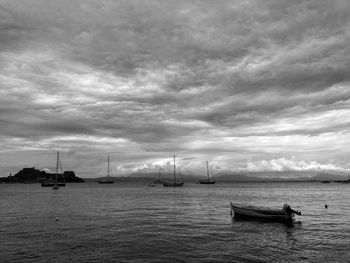 Scenic view of sea against cloudy sky