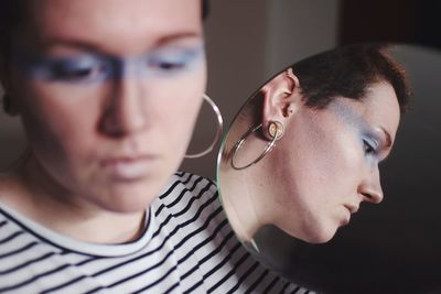 Close-up of young woman looking away