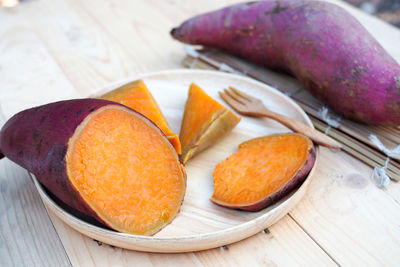 High angle view of fruits in plate on table