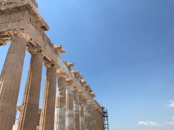 Low angle view of historical building against blue sky