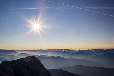 Scenic view of mountains against sky during sunset