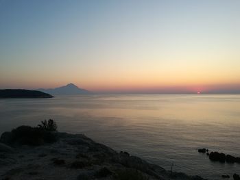 Scenic view of sea against clear sky during sunset