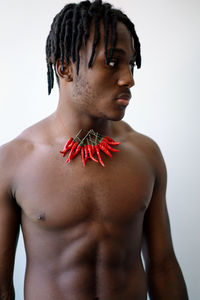 Black man wearing chili necklace portrait