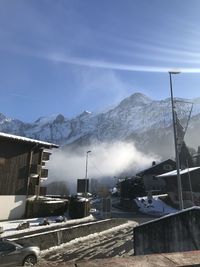 Scenic view of snowcapped mountains against sky