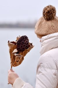 Midsection of woman holding ice cream