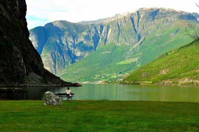 Scenic view of lake and mountains against sky