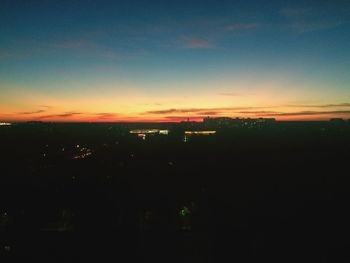 Silhouette buildings against sky during sunset