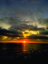 Scenic view of sunset over land