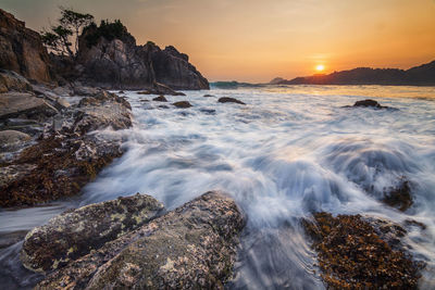 Scenic view of sea against sky during sunset