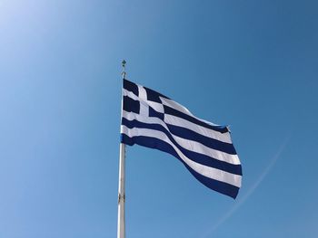 Greek flag against clear sky