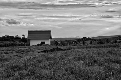 House on field against sky