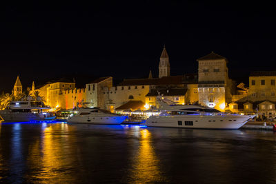 Illuminated buildings in city at night