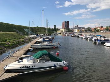 Sailboats moored in bay