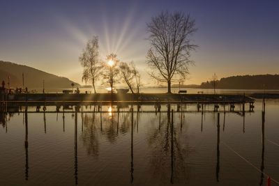 Scenic view of lake against sky during sunset