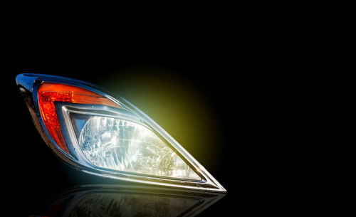 Low angle view of illuminated car against sky at night