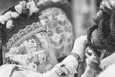 Ancient carnival of sauris. traditional wooden masks. black and white. italy