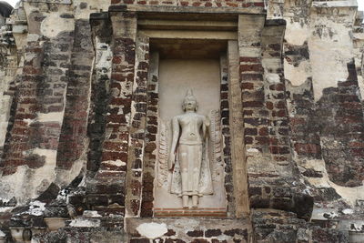 Statues on wall of historic building