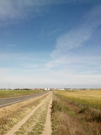 Road passing through field