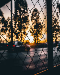 Sunset seen through chainlink fence