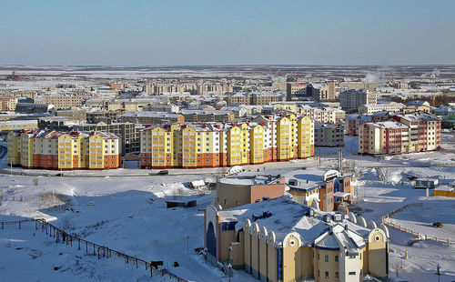 High angle view of buildings against sky during winter