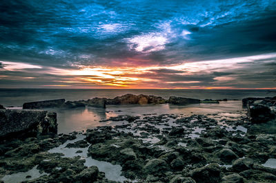 Scenic view of sea against sky at sunset