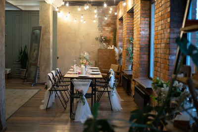 Empty chairs and tables in restaurant