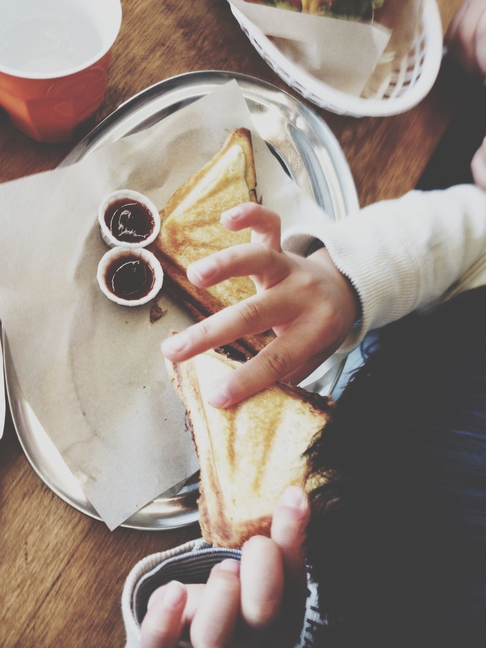 person, food and drink, holding, indoors, part of, cropped, food, freshness, human finger, table, lifestyles, unrecognizable person, leisure activity, men, drink, refreshment, close-up