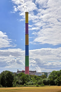 Low angle view of smoke stack against sky