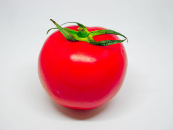 Close-up of strawberry over white background